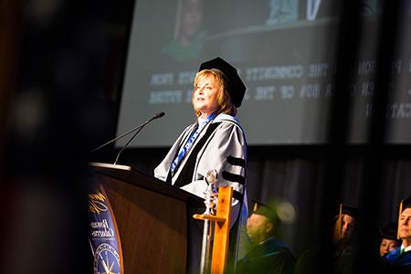 Dr. Spalding speaking at graduation